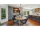 Stylish dining area with elegant lighting, wood accents, and natural light streaming through windows at 338 Mcclellan Ave, McClellanville, SC 29458