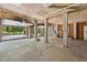 Unfinished garage features concrete floors, plywood ceiling and garage doors with automatic openers at 338 Mcclellan Ave, McClellanville, SC 29458