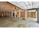 Unfinished garage features concrete floors, plywood ceiling and garage doors with automatic openers at 338 Mcclellan Ave, McClellanville, SC 29458