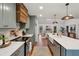 Updated kitchen with stainless appliances flows seamlessly into the home's bright, open living space at 338 Mcclellan Ave, McClellanville, SC 29458