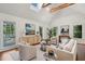 Comfortable living area with neutral decor, flooded with natural light and artistic accents at 338 Mcclellan Ave, McClellanville, SC 29458
