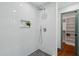 Modern shower with white subway tile, a built-in niche, and gray tile flooring at 338 Mcclellan Ave, McClellanville, SC 29458