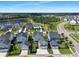 Aerial view of a vibrant neighborhood with mature trees, a pond and well-maintained landscaping at 360 Parish Farms Dr, Summerville, SC 29486