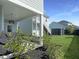 Spacious backyard featuring a well-maintained lawn, mulch beds, and a glimpse of the porch, perfect for outdoor living at 360 Parish Farms Dr, Summerville, SC 29486