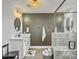 Elegant bathroom featuring modern fixtures, gray accent wall, white cabinets, and a stylish shower at 360 Parish Farms Dr, Summerville, SC 29486