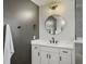 Modern bathroom featuring gray accent wall, white vanity, updated fixtures, and a luxurious tiled shower at 360 Parish Farms Dr, Summerville, SC 29486