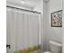 This bathroom features a striped shower curtain, toilet, and colorful beetle artwork at 360 Parish Farms Dr, Summerville, SC 29486