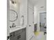 Bathroom showcasing gray vanity, round mirror, and direct access to an adjacent bedroom at 360 Parish Farms Dr, Summerville, SC 29486