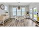 Bright dining room features a glass table, four chairs, and natural light at 360 Parish Farms Dr, Summerville, SC 29486
