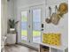 Cozy entryway featuring bench seating with bright pillows and a storage area for hats and bags at 360 Parish Farms Dr, Summerville, SC 29486