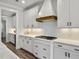 Bright kitchen features white cabinets, chevron backsplash, and stainless gas range at 360 Parish Farms Dr, Summerville, SC 29486