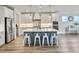 Spacious kitchen features a center island, stainless appliances, and modern light fixtures at 360 Parish Farms Dr, Summerville, SC 29486