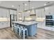 Open kitchen features a center island, stainless appliances, and custom white cabinets at 360 Parish Farms Dr, Summerville, SC 29486