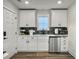 Cozy kitchenette with modern appliances, white cabinets, and sleek countertops at 360 Parish Farms Dr, Summerville, SC 29486