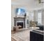 Living room with hardwood floors, fireplace, a mounted TV and a comfortable sectional sofa with pillows at 360 Parish Farms Dr, Summerville, SC 29486