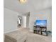 Cozy loft area with an ottoman, TV, and shelving, ideal for relaxation and entertainment at 360 Parish Farms Dr, Summerville, SC 29486