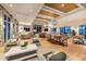 An open lounge area with stylish seating, tables, wood floors and decorative lighting creates a modern yet comfortable atmosphere at 360 Parish Farms Dr, Summerville, SC 29486