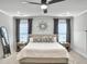Spacious bedroom with neutral decor, ceiling fan, and ample natural light from two windows at 360 Parish Farms Dr, Summerville, SC 29486