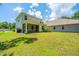Spacious backyard featuring a screened patio, perfect for outdoor relaxation and entertainment at 3745 Sawmill Ct, Mount Pleasant, SC 29429