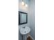 Powder room with a pedestal sink and a framed mirror at 3745 Sawmill Ct, Mount Pleasant, SC 29429