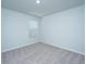 Empty bedroom with neutral carpet, white walls, window with blinds, and electric sockets at 3745 Sawmill Ct, Mount Pleasant, SC 29429