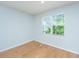 Bright bedroom features hardwood floors and large window views of the outside at 3745 Sawmill Ct, Mount Pleasant, SC 29429