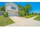 Well-maintained home featuring a two-car garage and a lush, landscaped yard at 3745 Sawmill Ct, Mount Pleasant, SC 29429