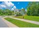 Beautiful two-story home on a corner lot with lush green lawn and trees at 3745 Sawmill Ct, Mount Pleasant, SC 29429