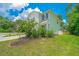 Charming two-story home with a well-maintained lawn and beautiful landscaping at 3745 Sawmill Ct, Mount Pleasant, SC 29429