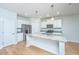 Bright kitchen with granite countertops, stainless appliances, and white cabinets at 3745 Sawmill Ct, Mount Pleasant, SC 29429