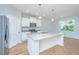 Charming kitchen features an island, stainless appliances, and bright recessed lighting at 3745 Sawmill Ct, Mount Pleasant, SC 29429