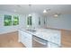 Kitchen island with granite countertop, stainless steel dishwasher, and pendant lights at 3745 Sawmill Ct, Mount Pleasant, SC 29429