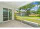 Relaxing screened patio area with a view of the well-maintained backyard at 3745 Sawmill Ct, Mount Pleasant, SC 29429
