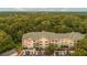 Scenic aerial view of the condo complex surrounded by lush greenery and mature trees at 400 Bucksley Ln # 301, Charleston, SC 29492