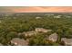 Expansive aerial shot of the community surrounded by the vibrant green tree canopy at 400 Bucksley Ln # 301, Charleston, SC 29492