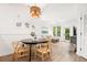 Dining area with modern table, decorative lighting, and access to an outside patio at 400 Bucksley Ln # 301, Charleston, SC 29492