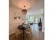 Bright dining area with wood floors, stylish lighting, and a seamless flow to the cozy living space at 400 Bucksley Ln # 301, Charleston, SC 29492