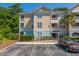 Condominium building with well-maintained landscaping and ample parking at 400 Bucksley Ln # 301, Charleston, SC 29492