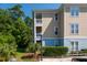 Multi-story building featuring private balconies and landscaped grounds at 400 Bucksley Ln # 301, Charleston, SC 29492