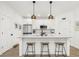 Bright kitchen with stainless steel appliances, white cabinets, pendant lighting, and breakfast bar seating at 400 Bucksley Ln # 301, Charleston, SC 29492