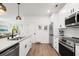Bright kitchen with stainless steel appliances and large island at 400 Bucksley Ln # 301, Charleston, SC 29492