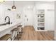 Kitchen with island, bar seating and view into foyer at 400 Bucksley Ln # 301, Charleston, SC 29492