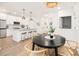Open kitchen featuring a kitchen island with seating, stainless steel appliances, and hardwood floors at 400 Bucksley Ln # 301, Charleston, SC 29492