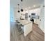 Modern kitchen with stainless steel appliances, ample counter space, and a stylish island with seating at 400 Bucksley Ln # 301, Charleston, SC 29492