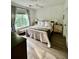 Bright bedroom with a large window, comfortable bed, hardwood floors, and soothing natural light at 400 Bucksley Ln # 301, Charleston, SC 29492