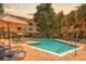 The beautiful community pool features ample lounge chairs and outdoor umbrellas at 400 Bucksley Ln # 301, Charleston, SC 29492