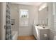 Bright bathroom with white cabinets, modern fixtures, and a shower-tub combination at 429 Venning St, Mount Pleasant, SC 29464