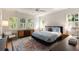 Bedroom with hardwood floors, natural light, ceiling fan, and an vibrant patterned rug at 429 Venning St, Mount Pleasant, SC 29464