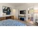 Bright bedroom featuring an ensuite bathroom, hard wood floors, and a TV mounted on the wall at 429 Venning St, Mount Pleasant, SC 29464