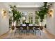 Bright dining area featuring natural light, a spacious table, and views of the surrounding greenery at 429 Venning St, Mount Pleasant, SC 29464